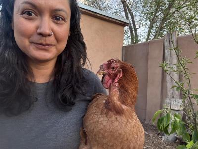 Desiree Triste-Aragon with a chicken
