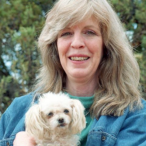 Magdalen Eckhoff holding a small white dog