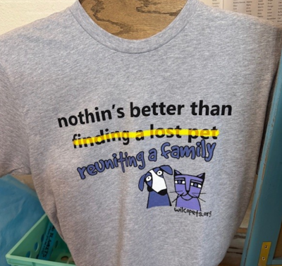 T-shirt with the words "finding a lost pet" crossed out so it says "nothin's better than reuniting a family"